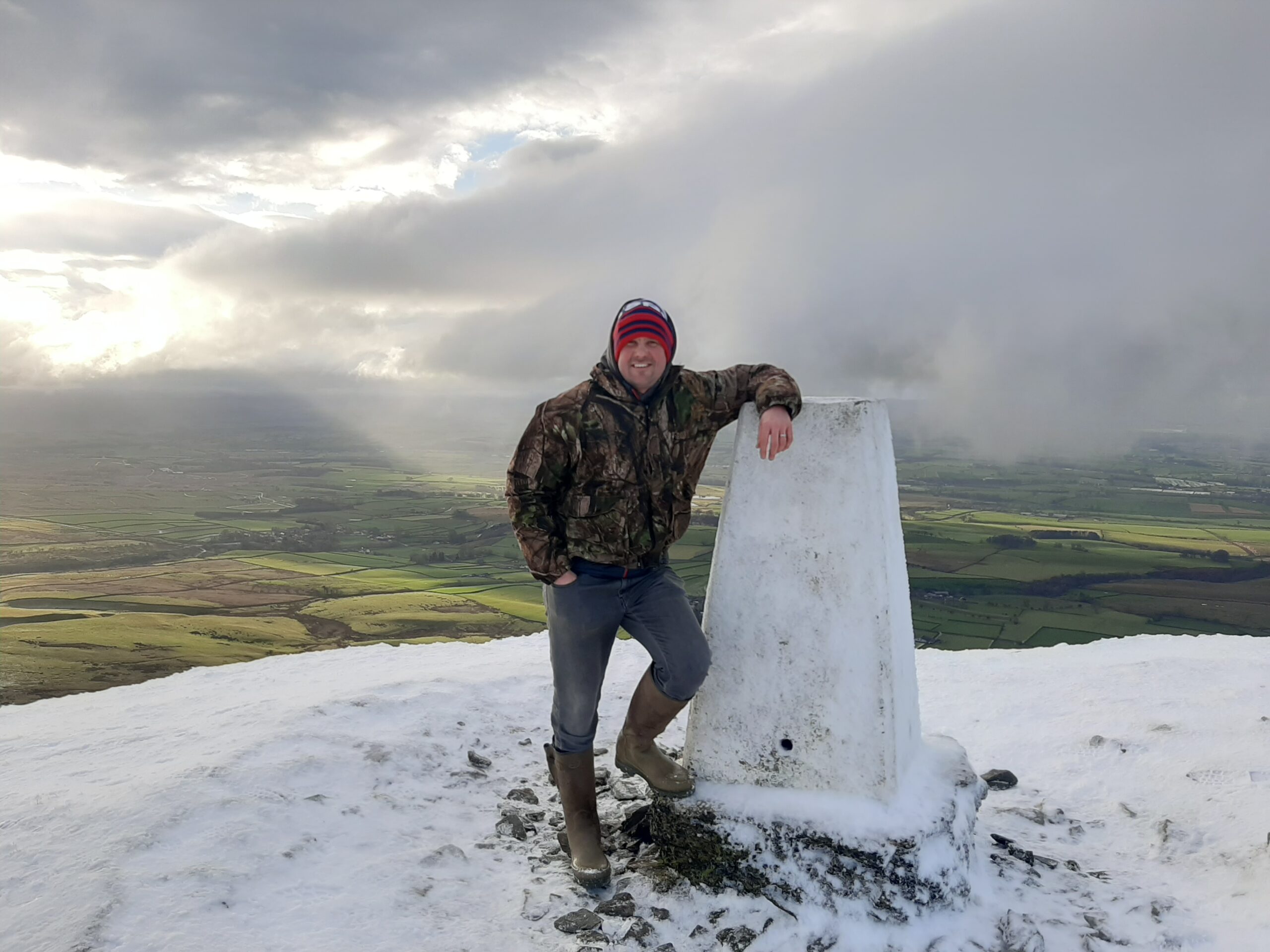 The summit of Murton Pike with views of the Eden Valley in background